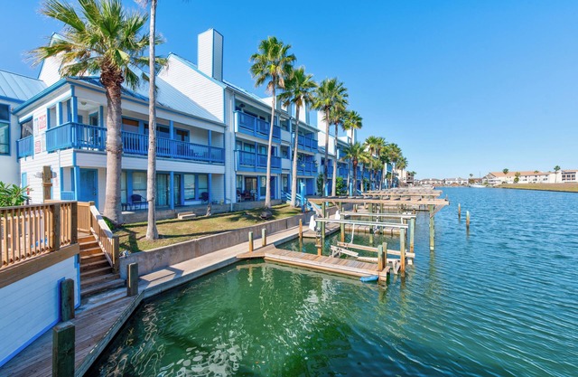 Waterfront Condo with Canal Views, Pool, Hot Tub & Private Balcony
