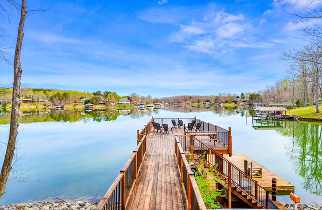 Waterfront lake-view home with dock, fireplace, pool table, kayaks, & firepit