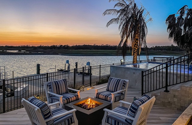 Waterfront paradise with private pool, dock, poolside TV & multi-TV game room