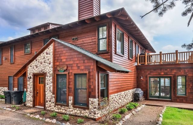 Waterfront resort condo with private dock, 4-season porch, & seasonal pool