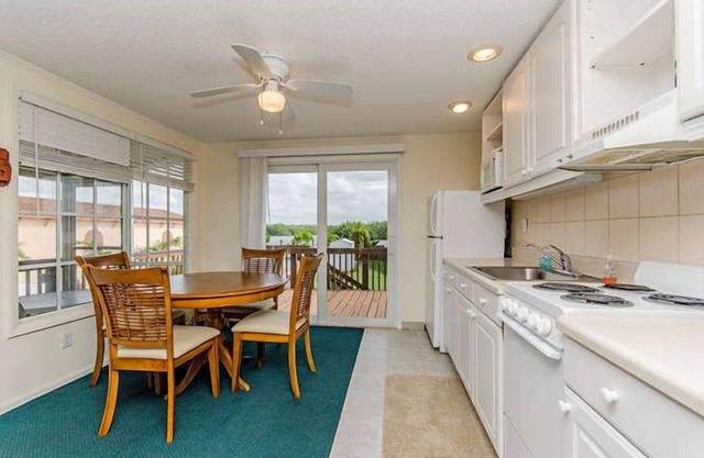 Waterfront Villa With Large Deck And Screened Front Porch Overlooking The Pool