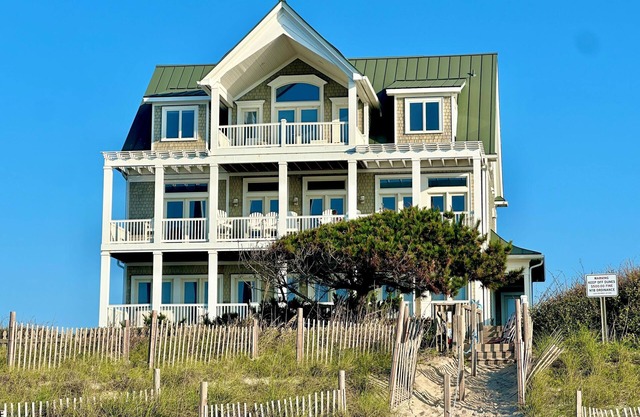 Wedding-friendly beachfront home with private heated pool, hot tub, & elevator