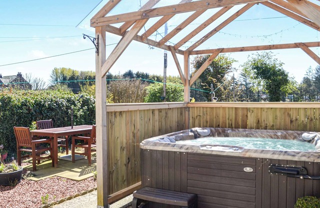 Where better to enjoy the hot tub in this delightful and private garden.