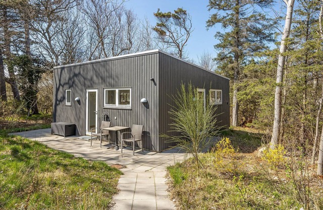 Wonderful, modern home on wooded lot right on the water.