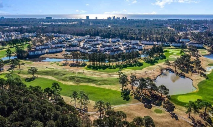 Central Myrtle Beach Condo | 1st Floor Unit W/Patio, Golf Course and Pool View, less than 10 Min to the Beach