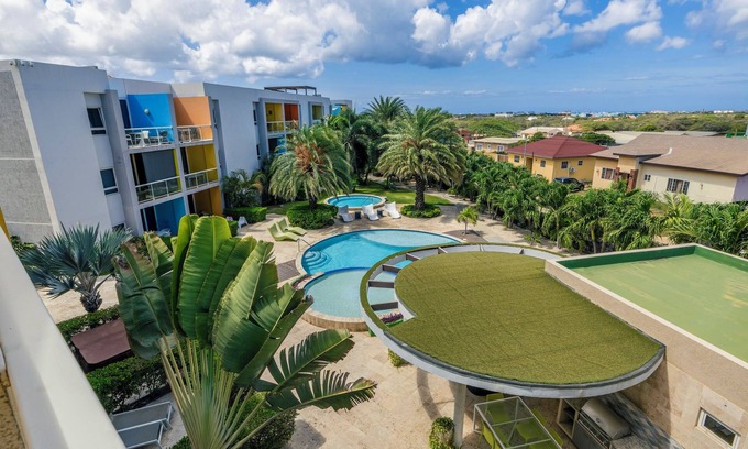 Boegoeroei Condo | 2 bedrooms and 2 baths in a tropical setting. Amazing outdoor spaces and a very convenient location. Less than 2 miles from stunning Eagle Beach and the High-rise hotel district with shopping, casinos and restaurants.