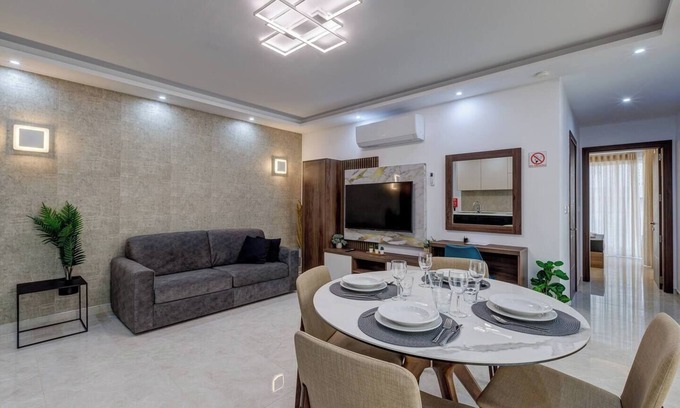 Bugibba Apartment | A modern apartment block in the heart of Bugibba. All one-bedroom flats, stylishly finished and fully equipped with comfort, ideally located close to shops, services, and all amenities.