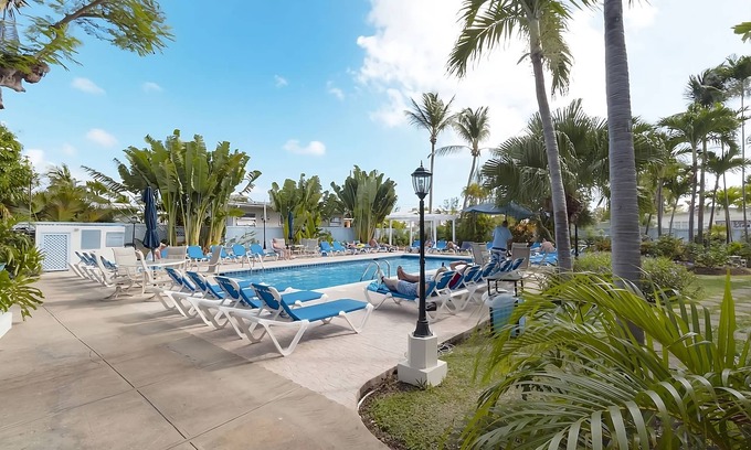St. Lawrence Gap Apartment | A Short Drive Away from Welches Beach! 4 Pool View Rooms w/Patio! FREE Parking!