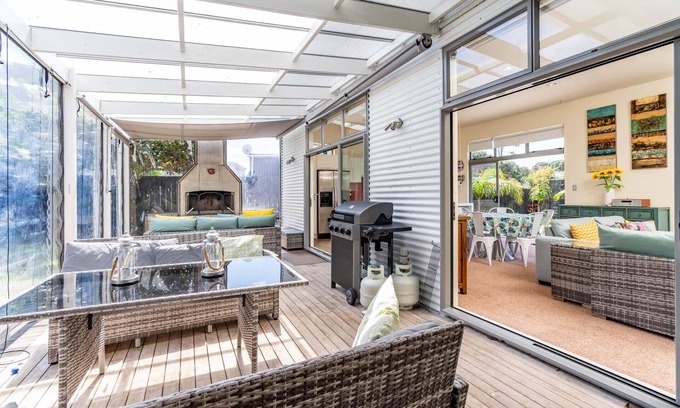 Mangawhai Heads House | All Decked Out - Modern holiday home with great covered outdoor entertaining space in handy location