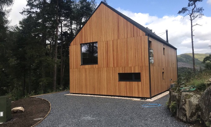 Crianlarich Ski Chalet | An Caisteal Lodge with cascading waterfall view