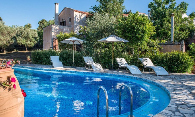 Vamos House | Antheia guest houses . Three houses in a big garden with swimming pool.