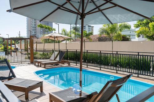 Picarras House | Apartamentos em Bal Piçarras 150 M DA PRAIA com Sacada Wi Fi, Piscina, Portaria 24h, Playground e vaga de GARAGEM