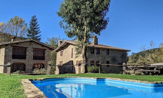 Santa Pau Apartment | Apartment 'Mas El Carrer - Blanc' with Shared Pool, Shared Garden and Wi-Fi
