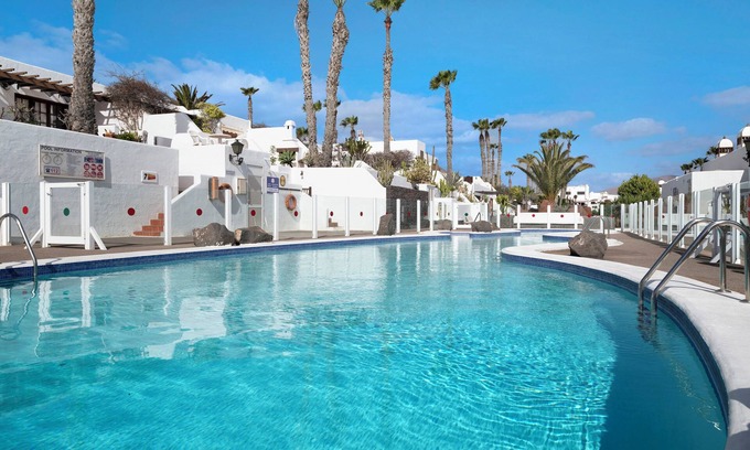 Playa Blanca Apartment | Apartment "Puerto Chico Q" with Sea View, Shared Pool, Terrace, A/C & Wi-Fi