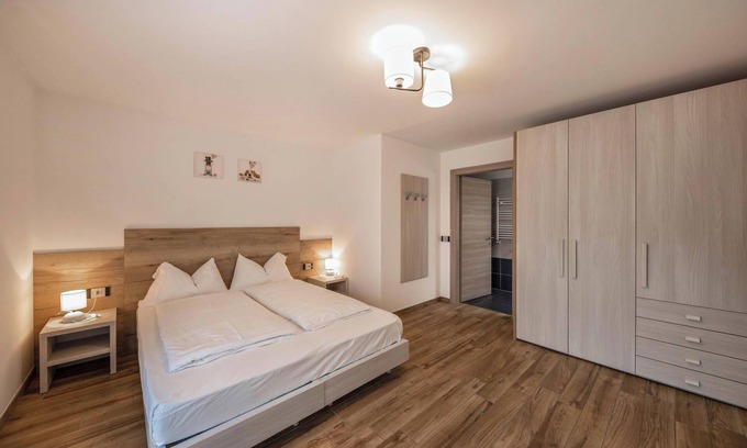 Predazzo Apartment | Apartment “Vacanze Arcobaleno - Viola” with Mountain View, Sauna & Whirlpool