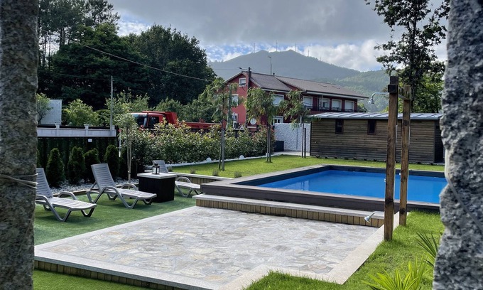 Outes Apartment | Apartment with pool steps from the beach