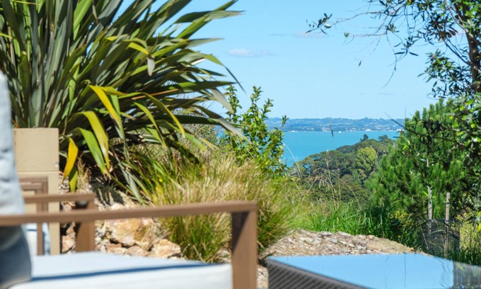 Palm Beach Cabin | Awaawa Yurts - Rangi Yurt - Awaawa Yurts offer a luxury glamping experience on Waiheke Island. Stunning views, luxury queen sized bed, private bathroom with tea and coffee making facilities.
