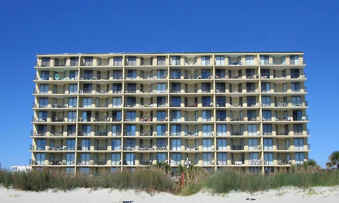 Atlantic Beach Apartment | Beach Club 6F - Oceanfront condo with a recliner and outdoor pool