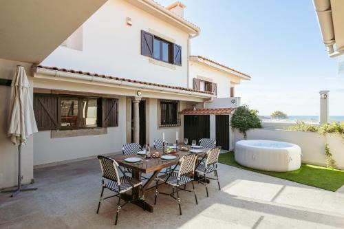 Vila Cha House | Beach Villa with Jacuzzi & Garage by HostWise