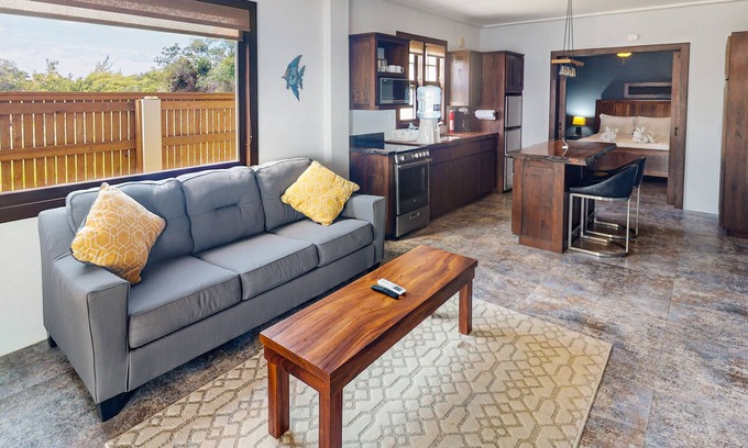Caye Caulker House | Beachfront suite with reef views - pool, bikes, canoes, dock, and grill access