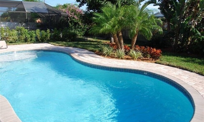 Naples Park House | Beautifully Decorated Beach Cottage with Sparkling Heated Pool