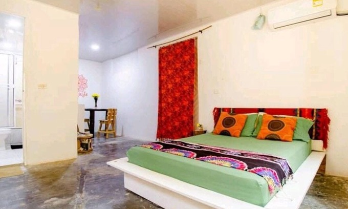 Papare House | Bedroom with air conditioning and private bathroom near the beach.