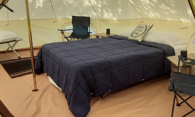 Spring Branch RV Rental | Bent Oak Glamping Tent Queen Bed, 2 Cots, Electric and AC