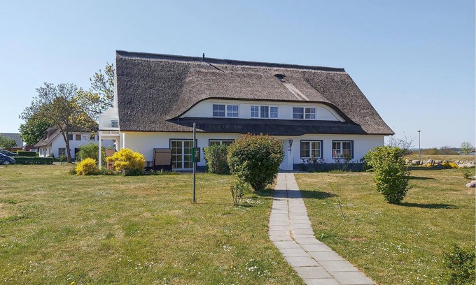 Monchgut-Granitz Apartment | "Between the Baltic Sea beach and the Bodden, the Boddenhus apartment house awaits you with its brig
