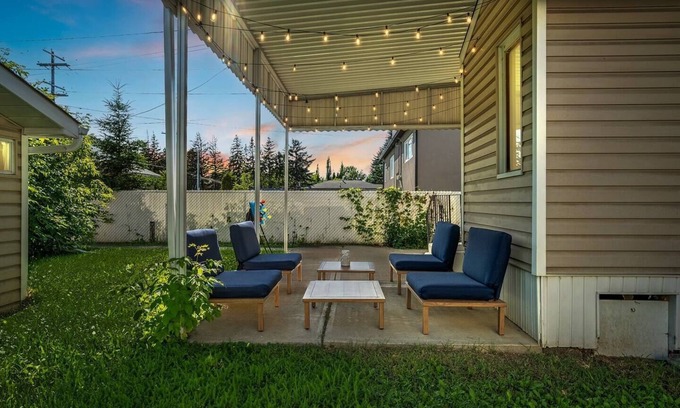 Southwest Edmonton House | Big, fun-filled stay steps from Whyte Ave with yard, games, and coffee bar