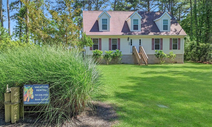 Piney Island House | Blue Heron, modern beach retreat with outdoor shower and screened porch