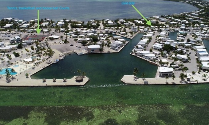 Cudjoe Key Cottage | Breezy Palm 2 bedroom with pool, hot tub, tennis courts, and boat access.