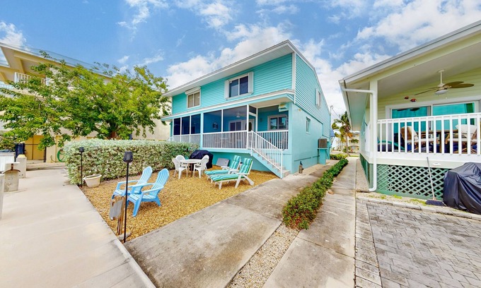 Key Colony Beach House | Canal-front duplex with Cabana Club membership, private dock, canal views, grill