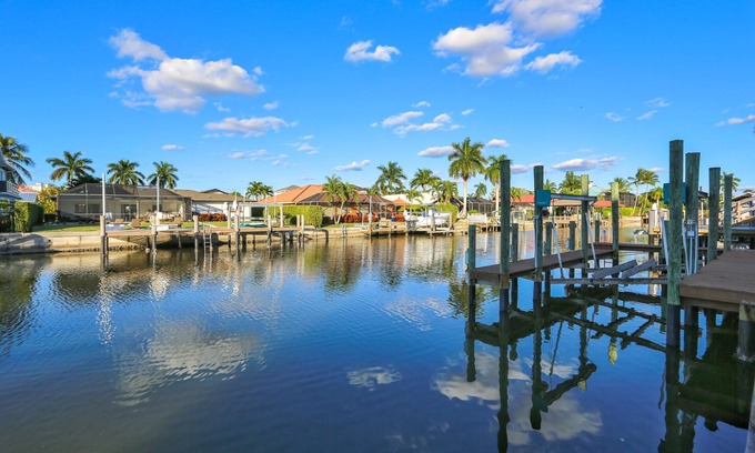 Vanderbilt Beach House | *CANAL FRONT HOME W/BOAT DOCK*HEATED POOL & SPA*WALK TO VANDERBILT BEACH*