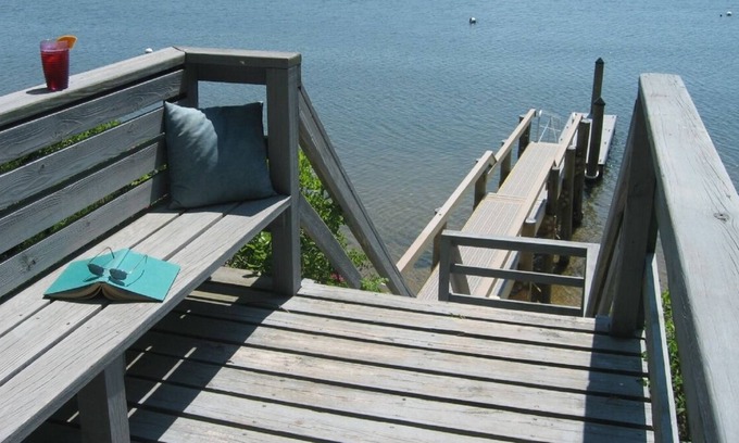 Mashpee Neck House | Cape Cod Waterfront Vacation Home dock and 2 kayaks: