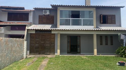 Tramandai House | Casa com 4 quartos e piscina pra aproveitar