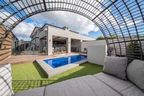 Safety Beach House | Casa de Praia - Luxe by the Bay with Heated Pool