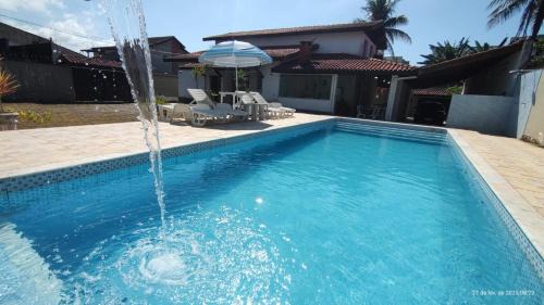Jardim Neptunia House | Casa piscina pé na areia Bertioga