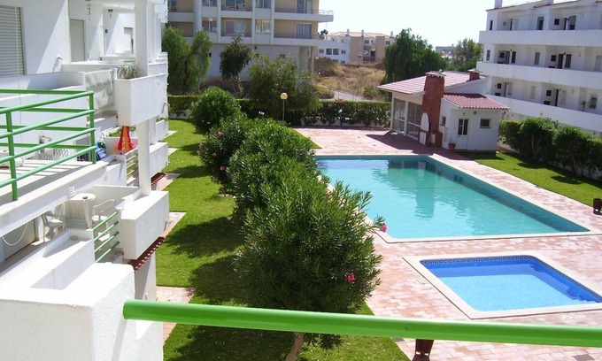 Areias de Sao Joao Apartment | Central apartment by the sea with pool and garden for 4 people.
