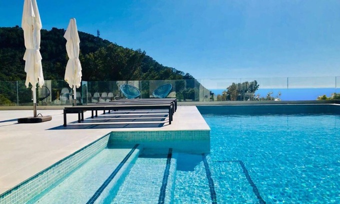 Cala Vadella Ski Chalet | Chalet 'Villa Esmeralda' with Sea View, Wi-Fi and Air Conditioning