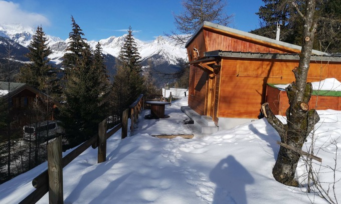 Valfrejus Ski Chalet | Chalet with terrace and breathtaking view. The grounds are adjacent to the chalet for BBQs etc.