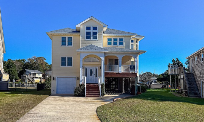 Colington Harbour House | Charming 4BR waterfront home with Private Hot Tub, Full kitchen, and WIFI