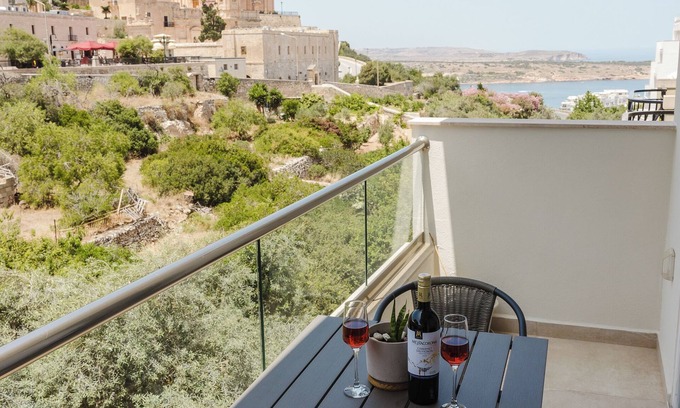 Mellieħa Heights Apartment | Charming apartment just steps from Mellieha’s main street and 5 minutes from the beach. Includes 2 double bedrooms, 1 twin room, Wi-Fi, Smart TV, coin-operated A/C, and all essentials like towels, linen, washing machine, and kitchen app