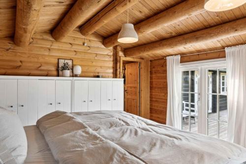 Bøtø By House | Charming Log Cabin Near The Sea
