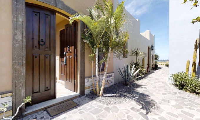 Nopolo House | Coastal retreat with sweeping ocean views, a huge patio, AC, WiFi & shared pool