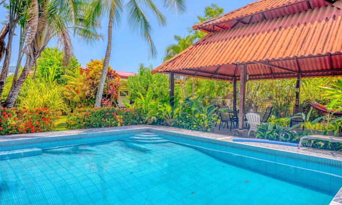 Barrio Ricos y Famosos House | Colorful, dog-friendly home with private pool, W/D, & lush setting