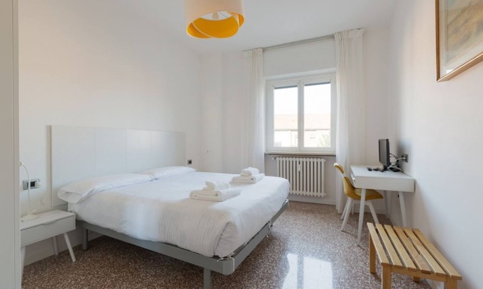 Lambrate Apartment | Comfortable 100sqm flat located on the fourth floor (with lift), equipped with kitchen, living area, two bathrooms and two bedrooms that can accommodate up to 4 people. A short walk from Lambrate and Udine stations, it is conveniently located to reach th
