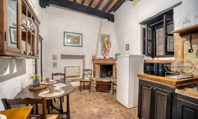Magione Apartment | Comfortable apartment located in a historic Abbey from the year 1000, restored in 1980.La Badia is a small Benedictine Abbey immersed in a park of centuries-old olive trees.Located on the ground floor, there is a mezzanine for the sleeping area.There are