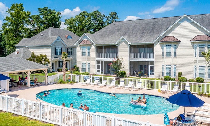 Little River House | Comfortable townhome with loft, shared pool, WiFi, AC, & W/D - near beach & golf
