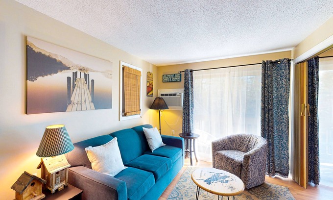 Gilford Condo | Conveniently located condo w/a balcony, access to sports courts & private beach