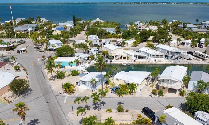 Cudjoe Key RV Rental | Corner RV Lot with Lagoon Views, Palm Trees, and Steps to Pool & Amenities